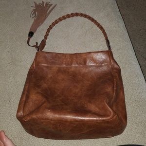 Leather purse with braid strap and tassle